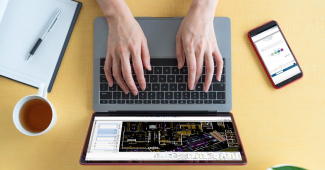 person on laptop computer using DraftSight